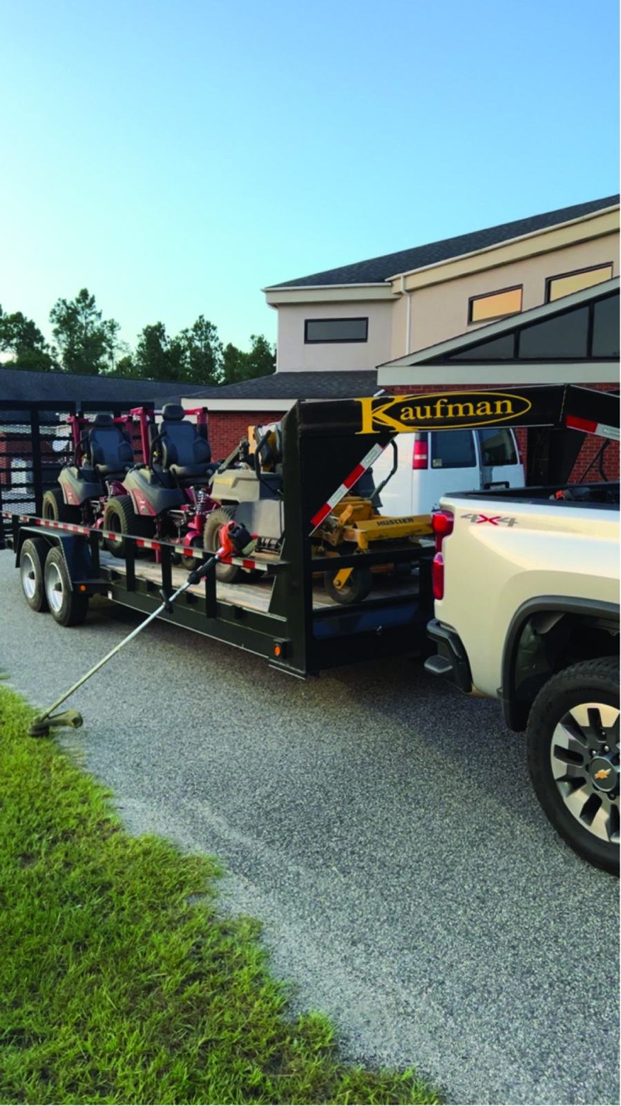 Commercial mowers loaded on a trailer